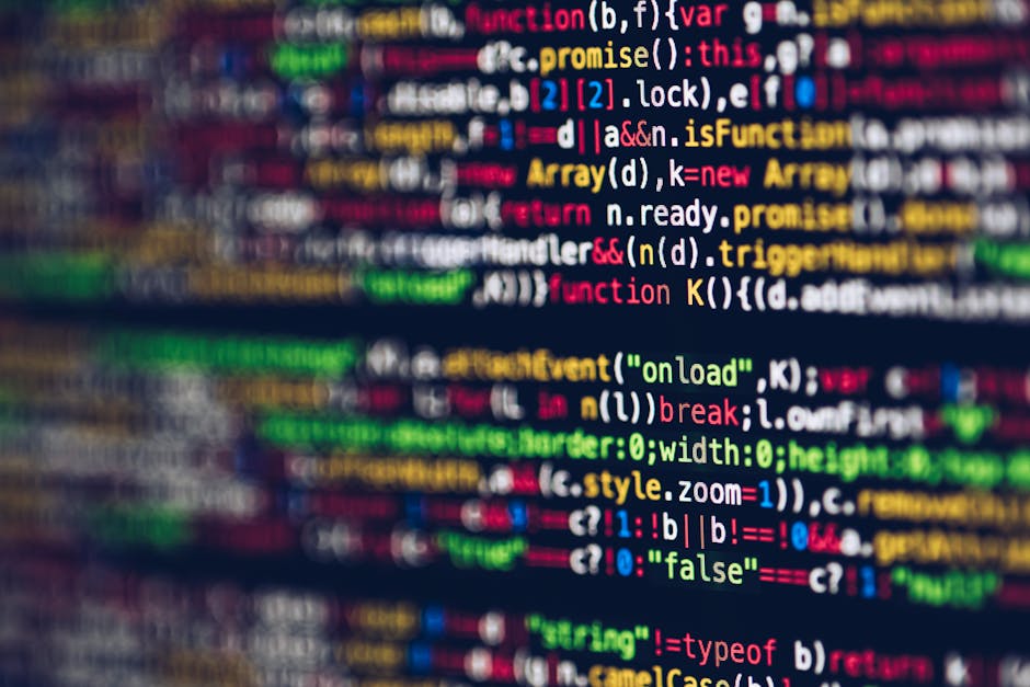 Close-up image of colorful computer code displayed on a screen, with lines of programming language including keywords, variables, and functions in various colors such as red, yellow, green, blue, and 